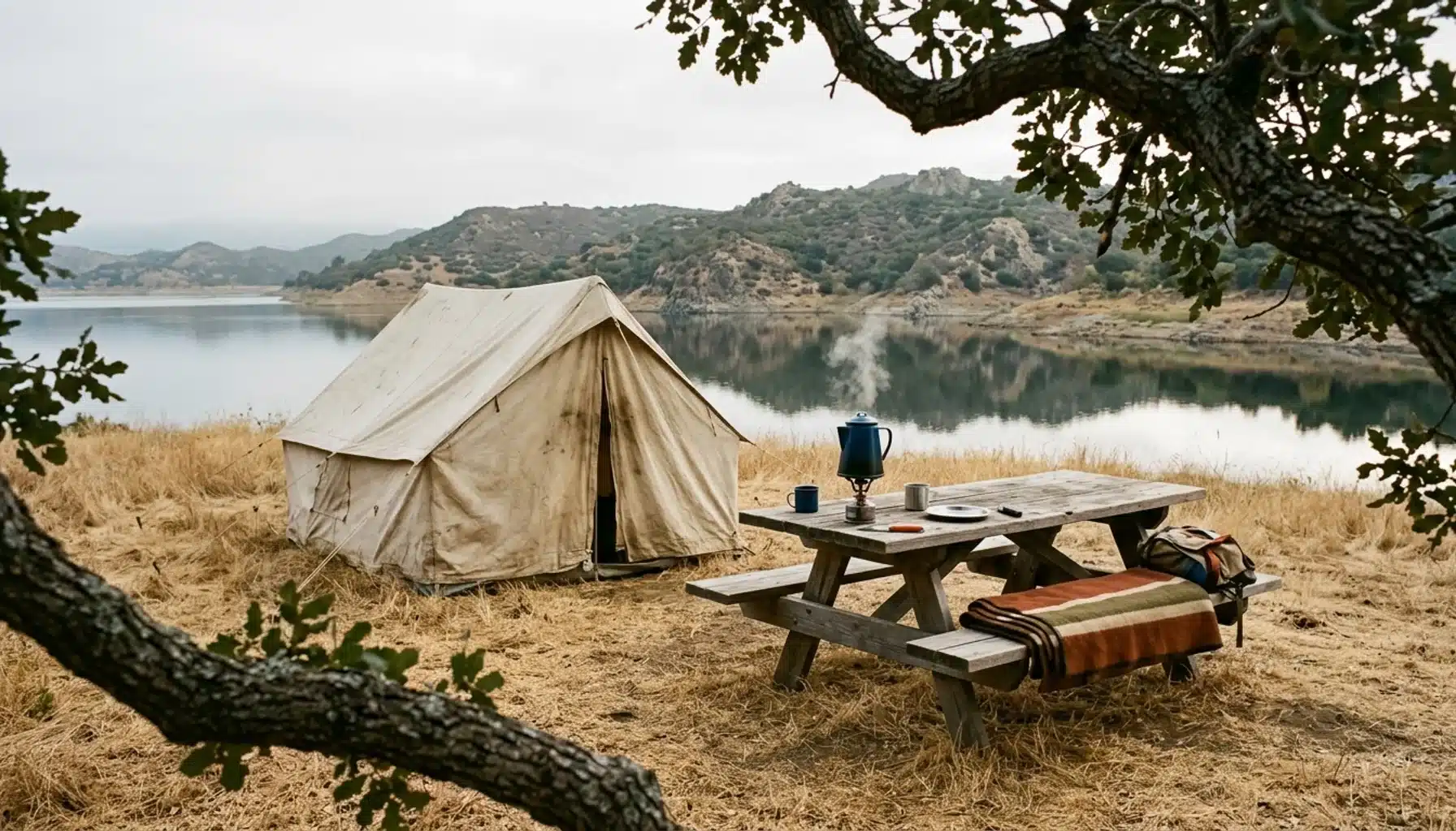 Tent and camp stove beside Lake Casitas, a classic ojai camping spot on an overcast morning