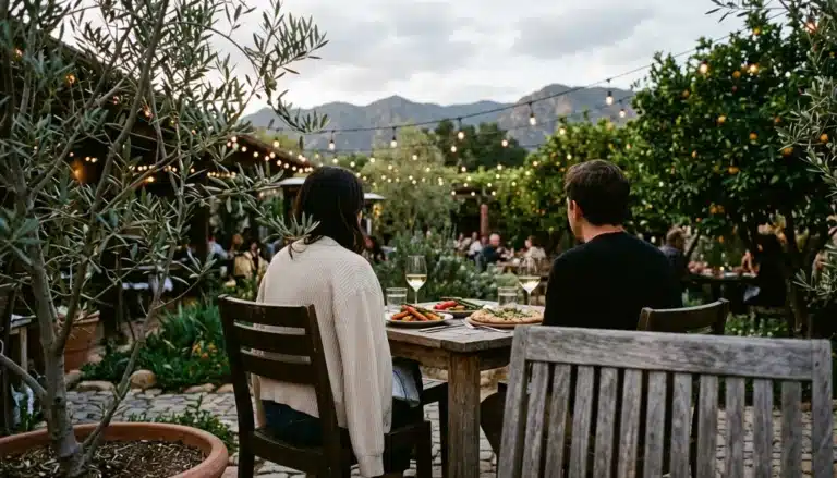 Diners on an Ojai restaurant patio on a mild evening, a reminder to pack layers for Ojai weather